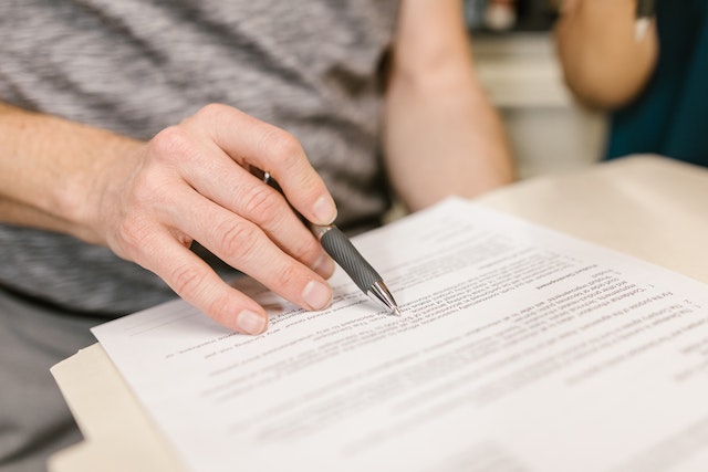  a person reading a contract